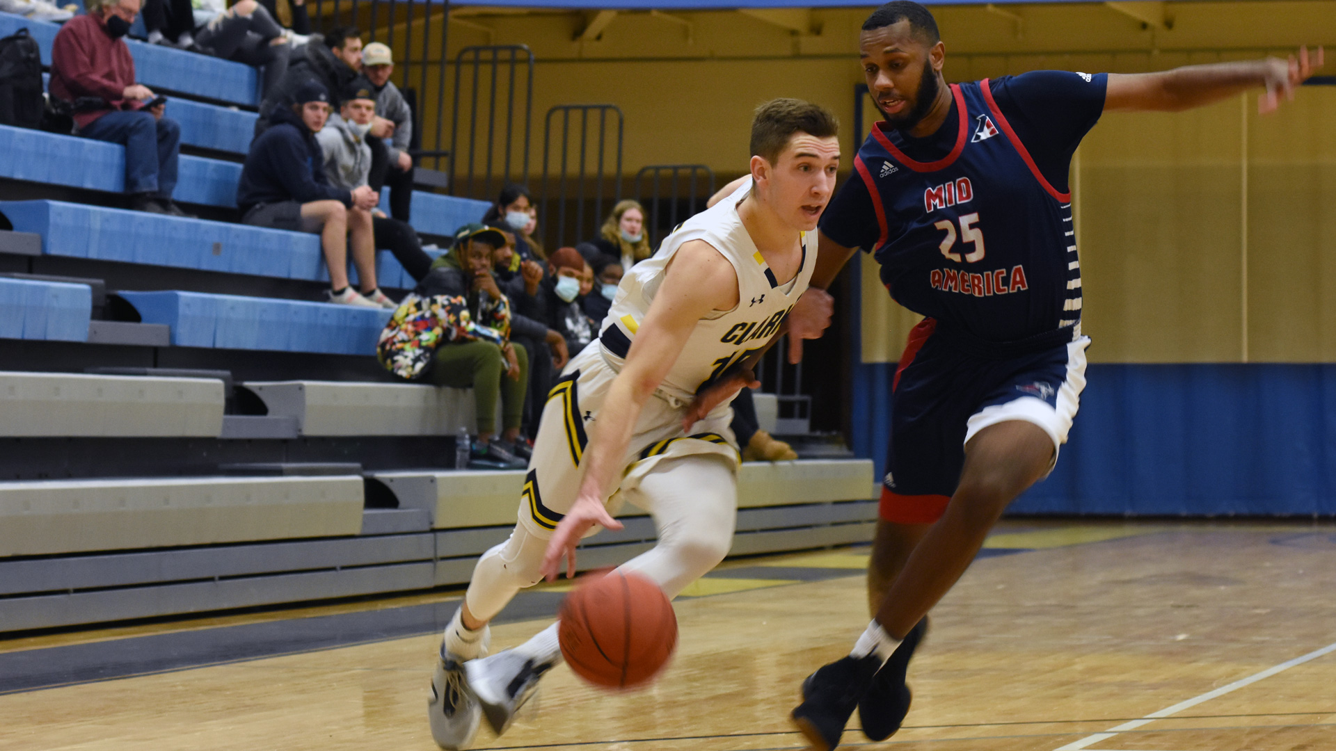 Clarke's Jordan Lake driving by a defender towards the basket.