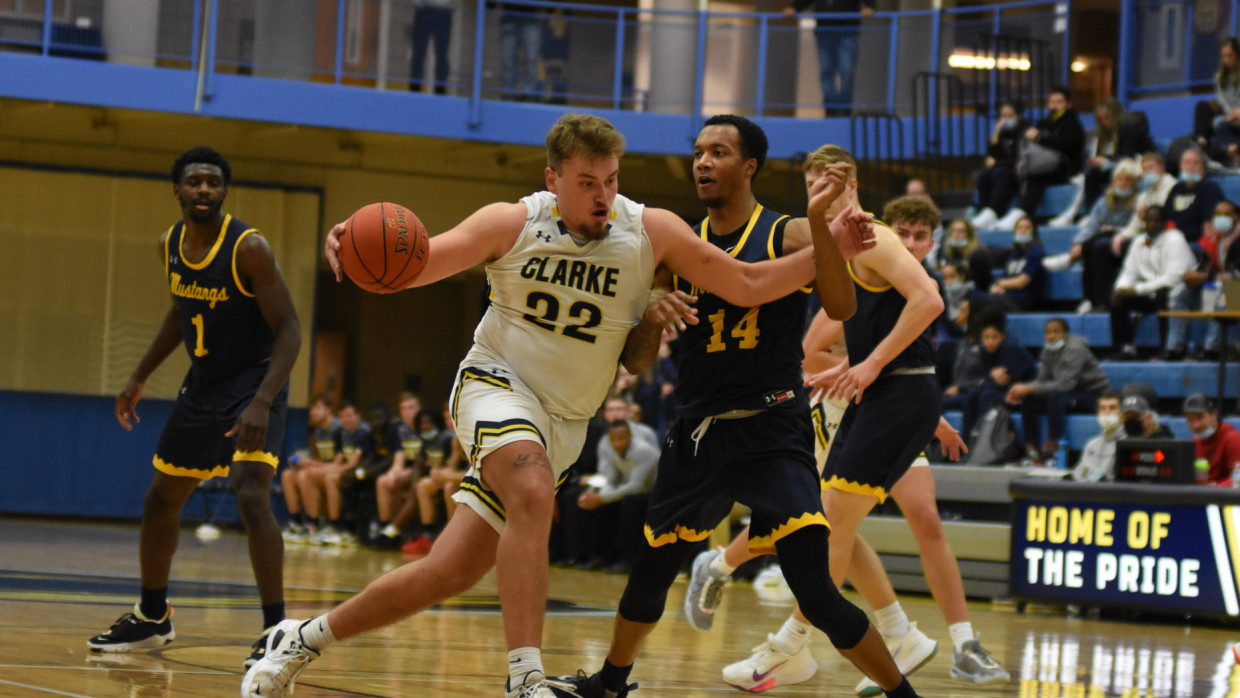 Clarke's Jacob Fierst driving to the basket against his defender