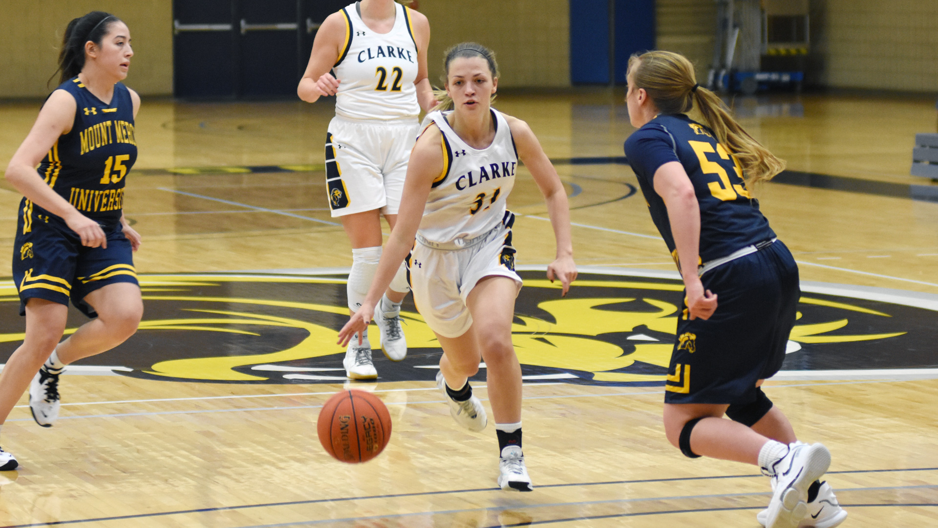Clarke's Hannah Ambrosy drives the lane against a defender