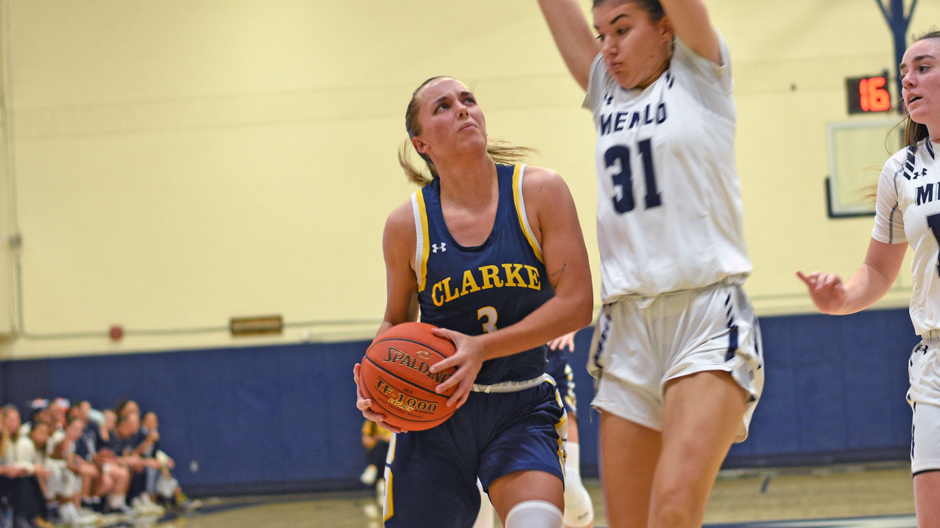 Clarke's Izzie Peterson driving towards the basket